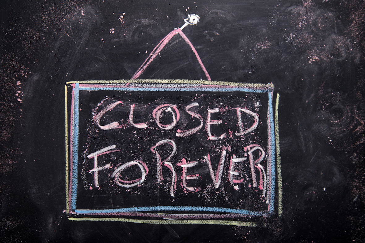 Sign indicating local shop will be closed forever